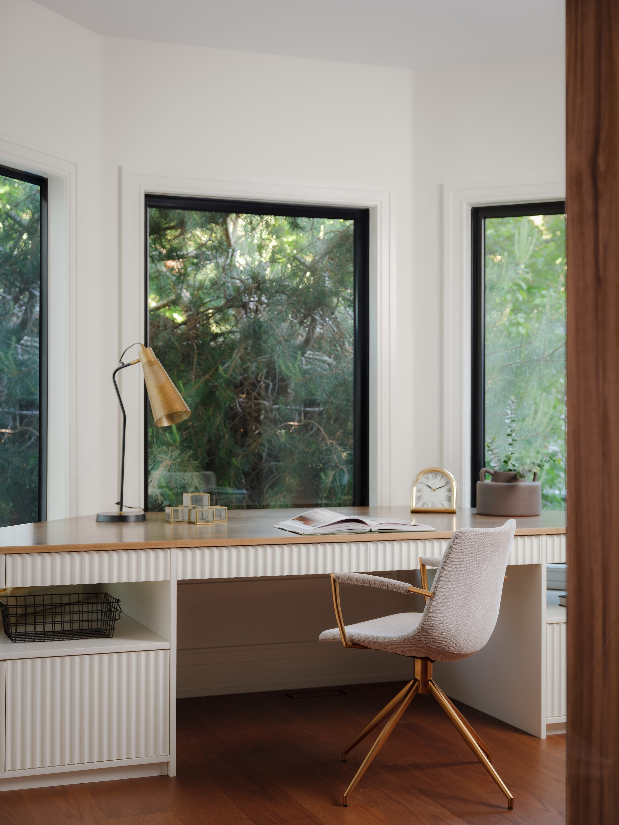 Home office with bay windows